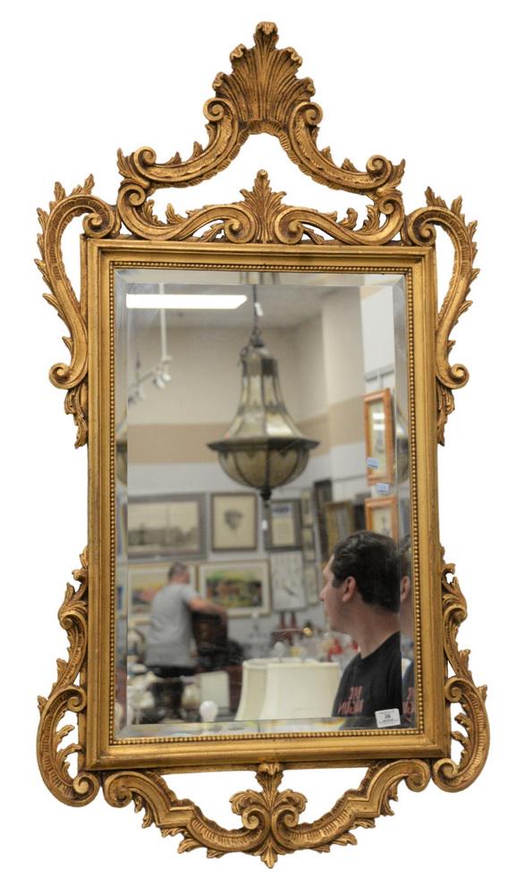 Chippendale style mirror with gold frame, height 54: Chippendale style mirror with gold frame, height 54 inches, width 30 inches.