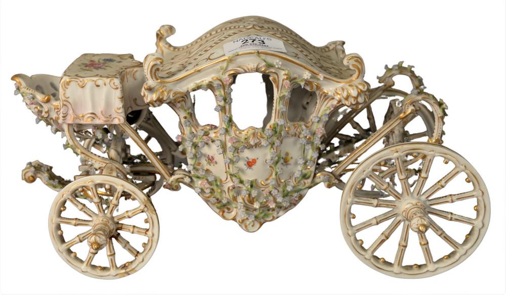 German porcelain carriage having blue floral and gilt: German porcelain carriage having blue floral and gilt details, height 6 inches, length 11 inches, width 4 3/4 inches.