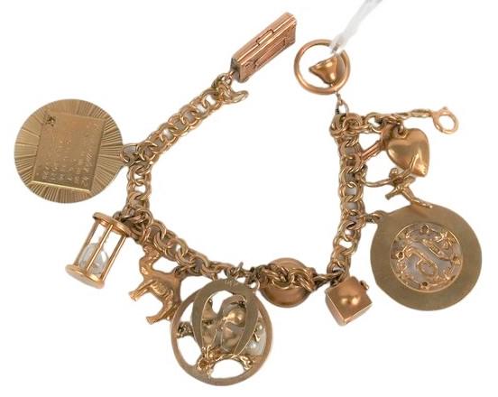 14 Karat Gold Charm Bracelet, having 12 charms, 9 (1 of 3)