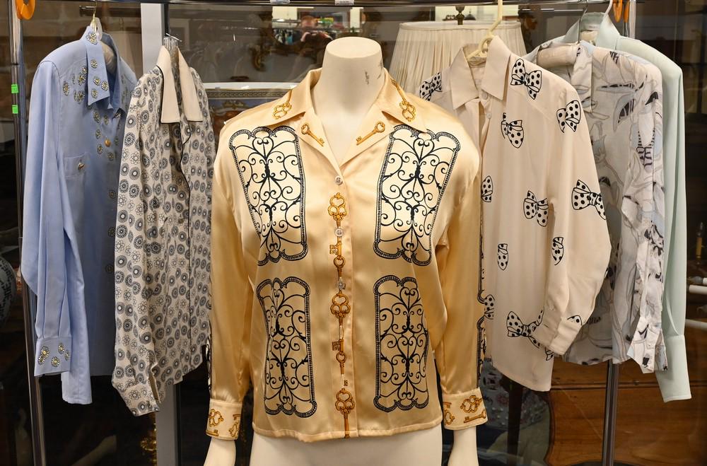 Six Escada Shirts and Blouses, to include one in blue: Six Escada Shirts and Blouses, to include one in blue cotton with embroidered daisies, along with silk prints, size S/M, condition consistent with normal wear.