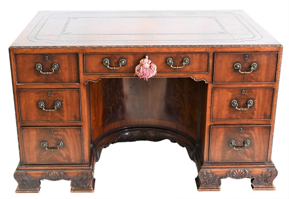 English Mahogany Kneehole Desk, having tooled leather: English Mahogany Kneehole Desk, having tooled leather top, concave interior kneehole area, height 30 1/2 inches, top 33 x 50 inches.