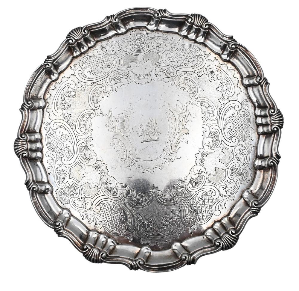Robert Rew, 1754, silver salver having scrolled and fan: Robert Rew, 1754, silver salver having scrolled and fan carved edge along with overall chased design, height 1 1/4 inches, diameter 10 inches, 18.7 t.oz. Provenance: Property from the Estate of Alexis