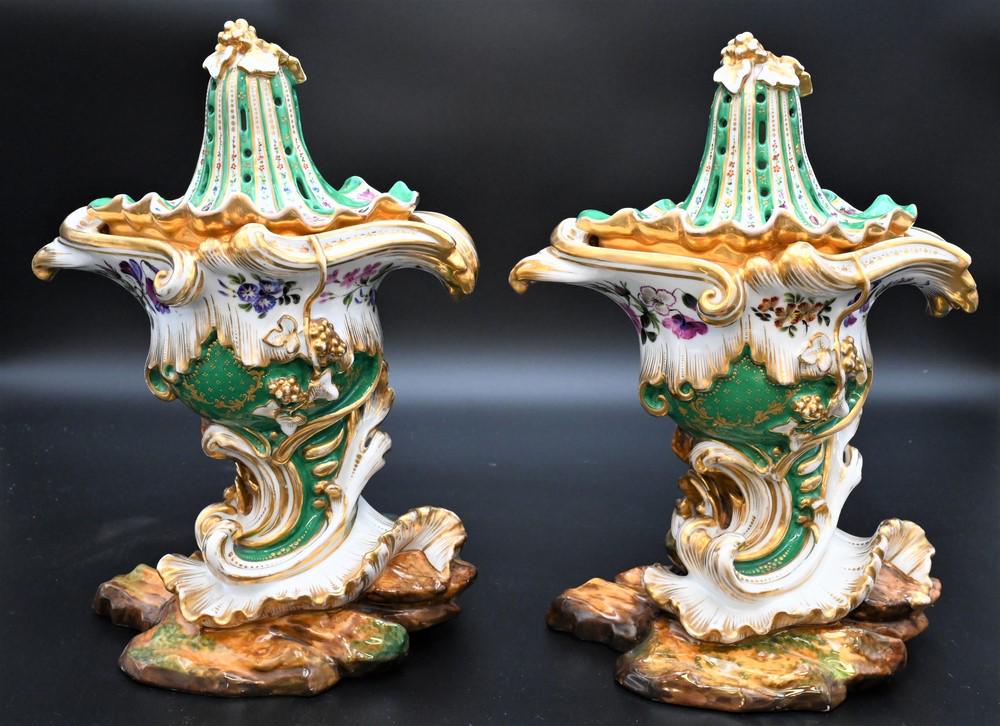 Pair of French Porcelain Potpourri Pots, Vaisseau a: Pair of French Porcelain Potpourri Pots, Vaisseau a mat, having reticulated covers, highly decorated with scroll bases on rock style bottoms, each marked JP on bottom (possibly Jacob Petit 1796 - 1865