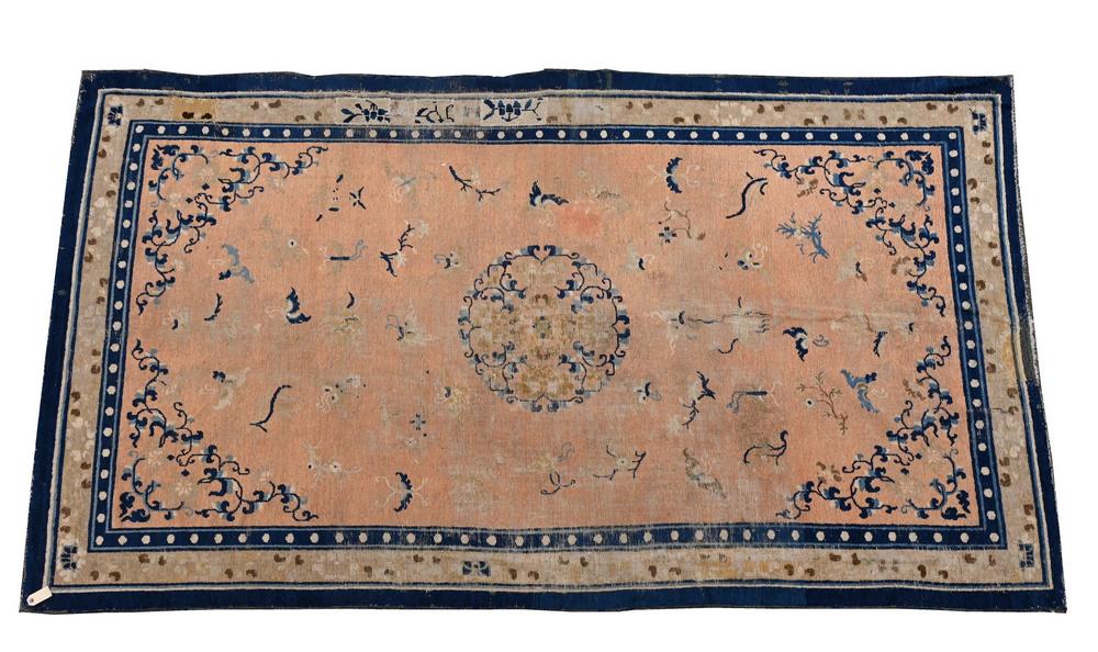 Chinese Oriental Area Rug, salmon background with: Chinese Oriental Area Rug, salmon background with moths, probably 19th century, 5' 10" x 10' 5", (very worn/patched).