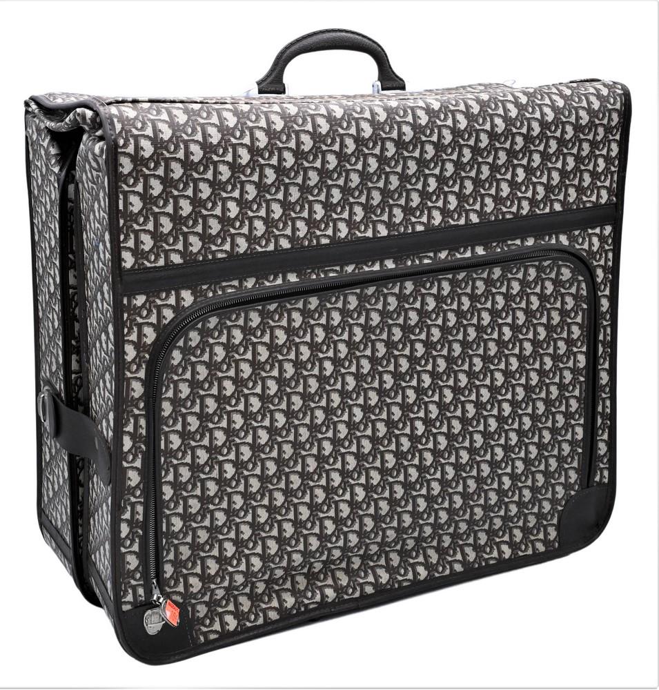 Christian Dior Monogrammed Luggage Bag, folding: Christian Dior Monogrammed Luggage Bag, folding suitcase, marked Christian Dior, height 22 inches, width 24.5 inches.