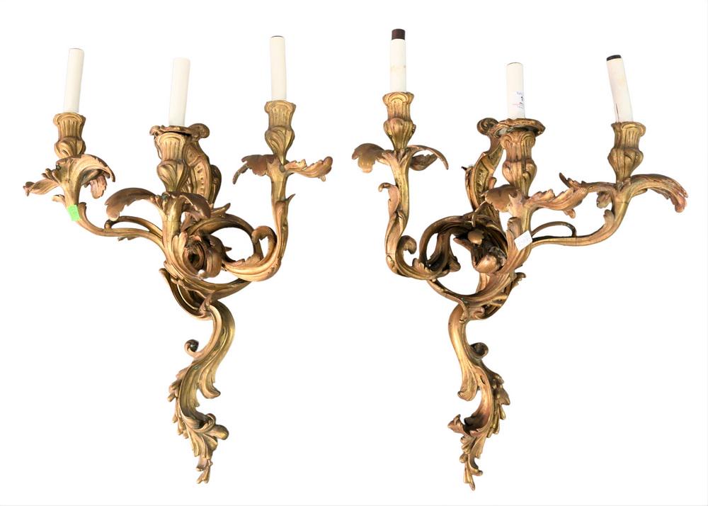 Pair of French Bronze Candle Sconces, each having three: Pair of French Bronze Candle Sconces, each having three lights, height 19 inches.