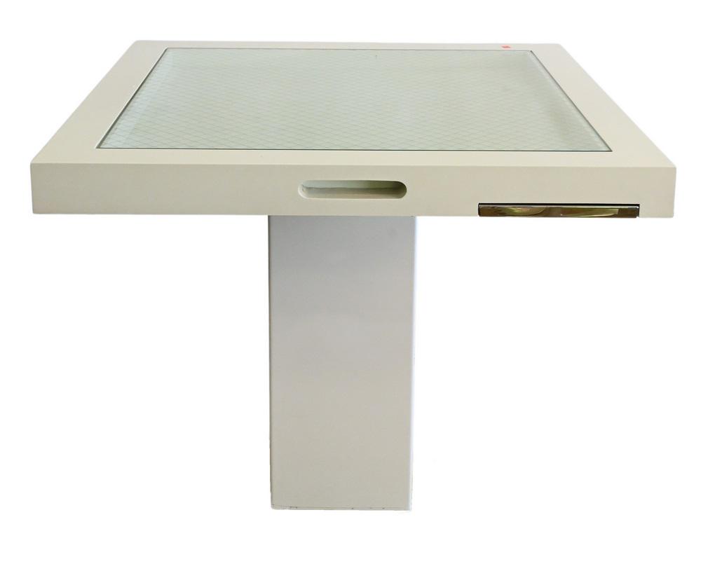 Enrique Garcel Style Games Table, in white lacquer with: Enrique Garcel Style Games Table, in white lacquer with glass top over four pull out slides on single pedestal, no stamped marks or signatures found, height 28 inches, top 36” x 36”.