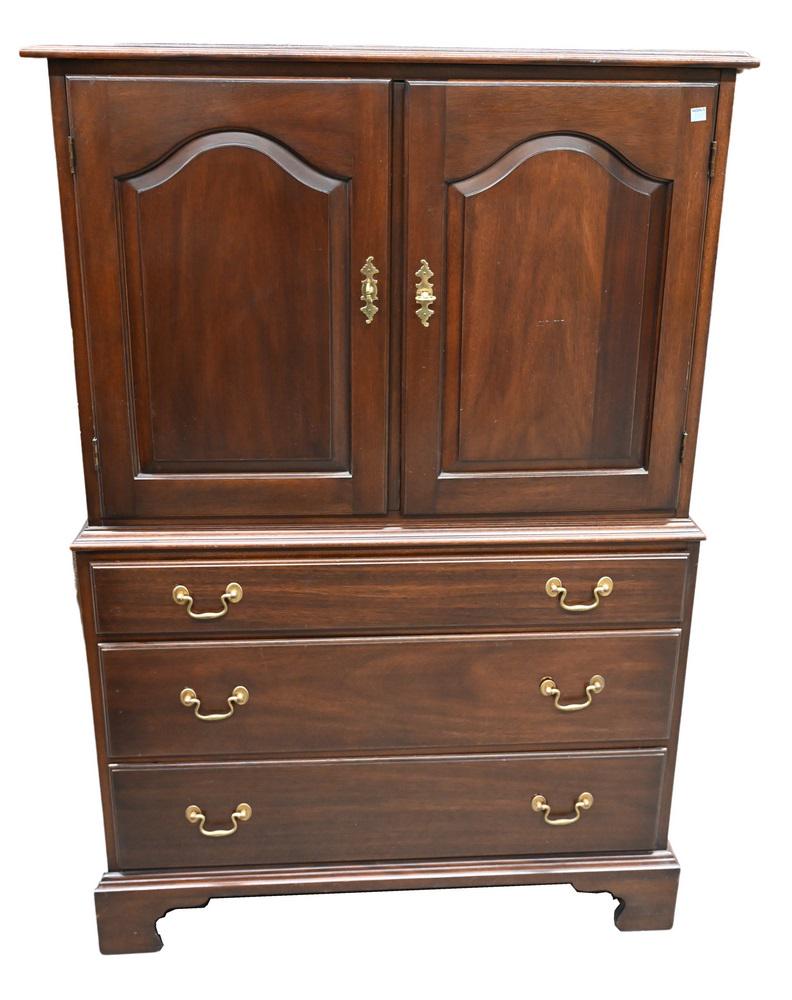 Henkel Harris Mahogany Tall Chest, having two doors: Henkel Harris Mahogany Tall Chest, having two doors over three drawers, height 55 inches, top 20 1/2" x 36 1/4".
