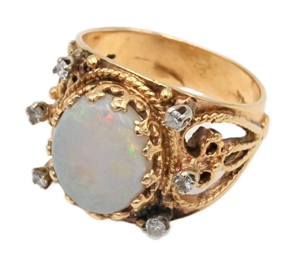 14 Karat Gold Ring, set with oval opal flanked by diamonds, size 7, 7.4 grams. (1 of 3)