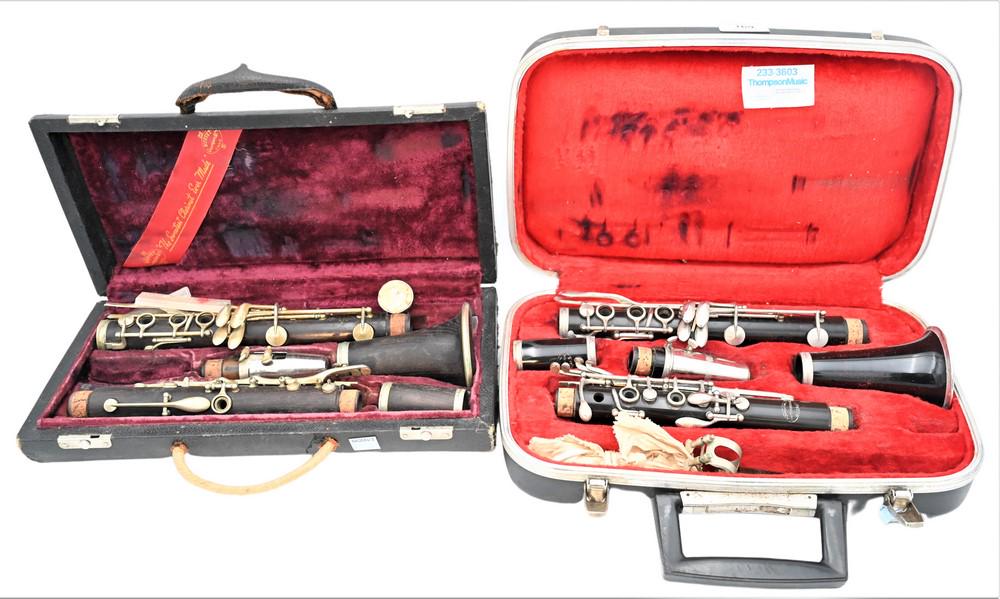 Two Clarinets, to include one made of wood, one Evette; both made in Paris, in cases. (1 of 6)
