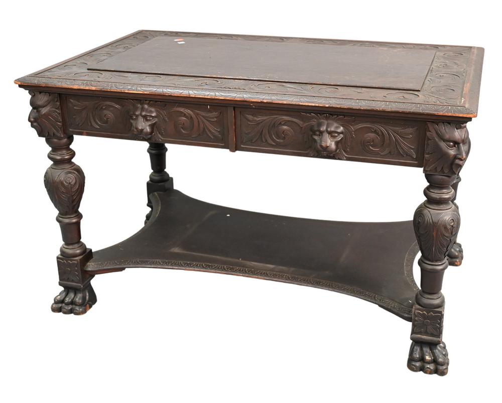 Mahogany Carved Center Table, circa 1900, having two drawers with lion mark handles, corners and (1 of 4)