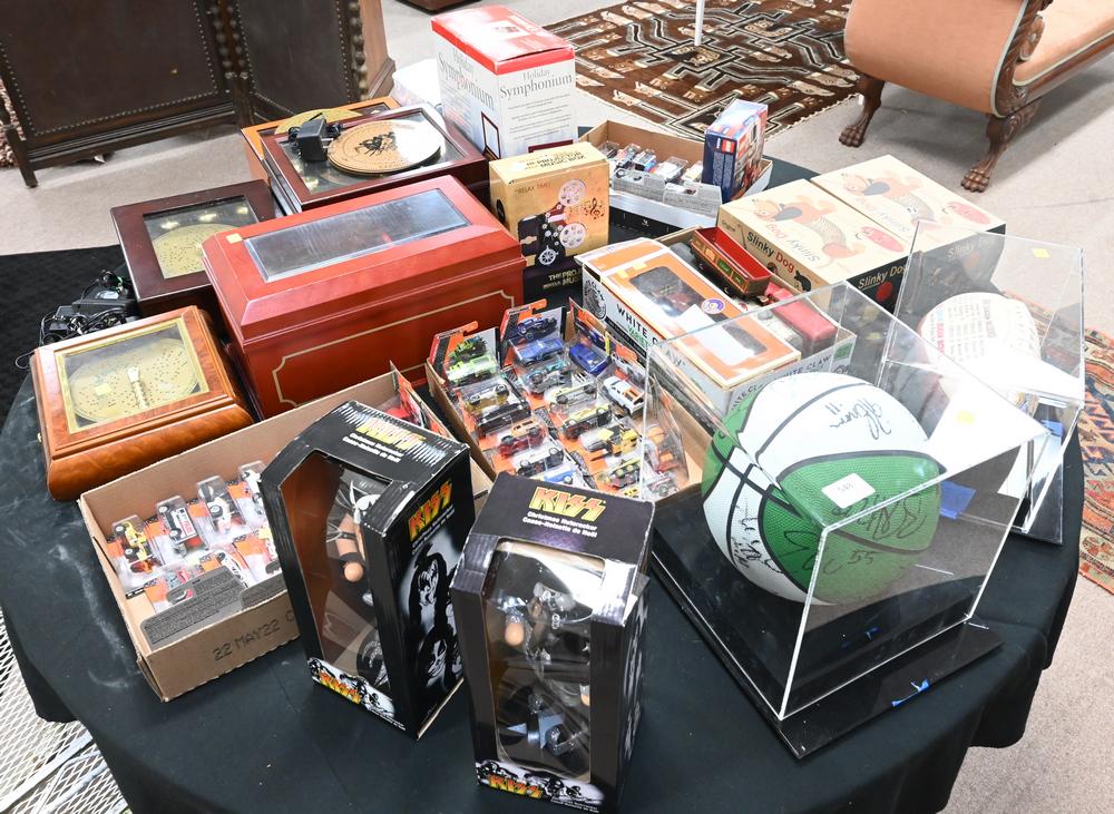 Table Lot, to include Lionel cars, Matchbox cars, six music boxes, early 2000's signed Celtics (1 of 7)