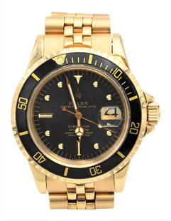 Rolex Submariner 18 Karat Gold Wristwatch, having Jubilee band along with original 1980 warranty: Rolex Submariner 18 Karat Gold Wristwatch, having Jubilee band along with original 1980 warranty paper, 40 millimeter, #5860623, having brown leather Rolex box.