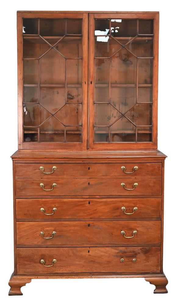 Chippendale Mahogany Butlers Secretary Desk, in two parts, upper section with two glazed doors,: Chippendale Mahogany Butlers Secretary Desk, in two parts, upper section with two glazed doors, lower section with pullout desk over three drawers, on ogee feet, New England circa 1780, (top cornice m