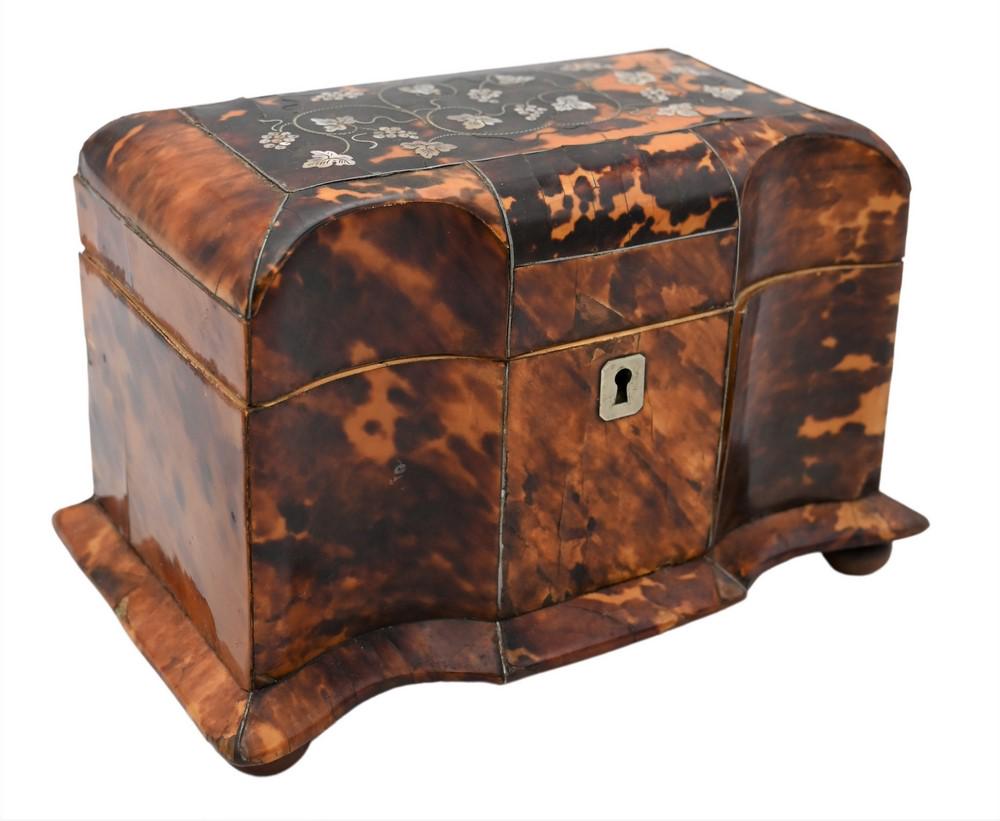 English Tortoise Shell Tea Caddy, having serpentine front, along with mother of pearl inlaid grape: English Tortoise Shell Tea Caddy, having serpentine front, along with mother of pearl inlaid grape vines on top opening to two compartments, height 5 inches, width 7 1/2 inches, depth 4 1/2 inches.