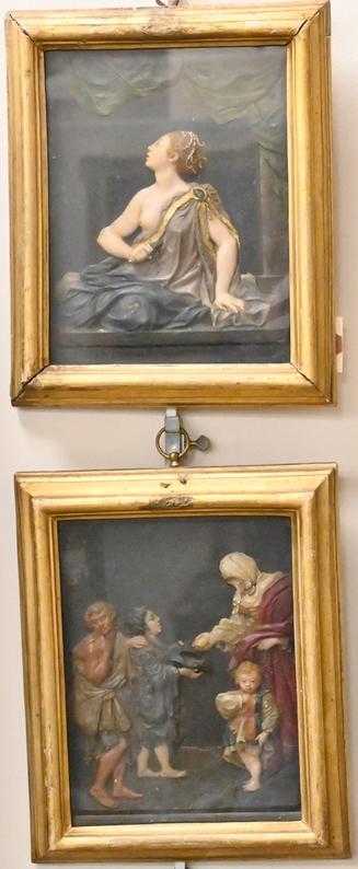 Pair of Wax Relief Plaques, offering with four figures and a classical partially clad figure of a: Pair of Wax Relief Plaques, offering with four figures and a classical partially clad figure of a woman stabbing herself, 18th century or later in shadow box frames, 7 3/4" x 6".