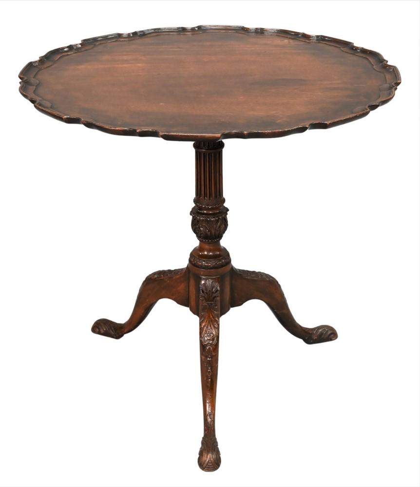 Chippendale Mahogany Tip Table, having piecrust edge on fluted and carved shaft, on tripod base with: Chippendale Mahogany Tip Table, having piecrust edge on fluted and carved shaft, on tripod base with carved feet, height 28 1/2 inches, top 29 1/2" x 30".