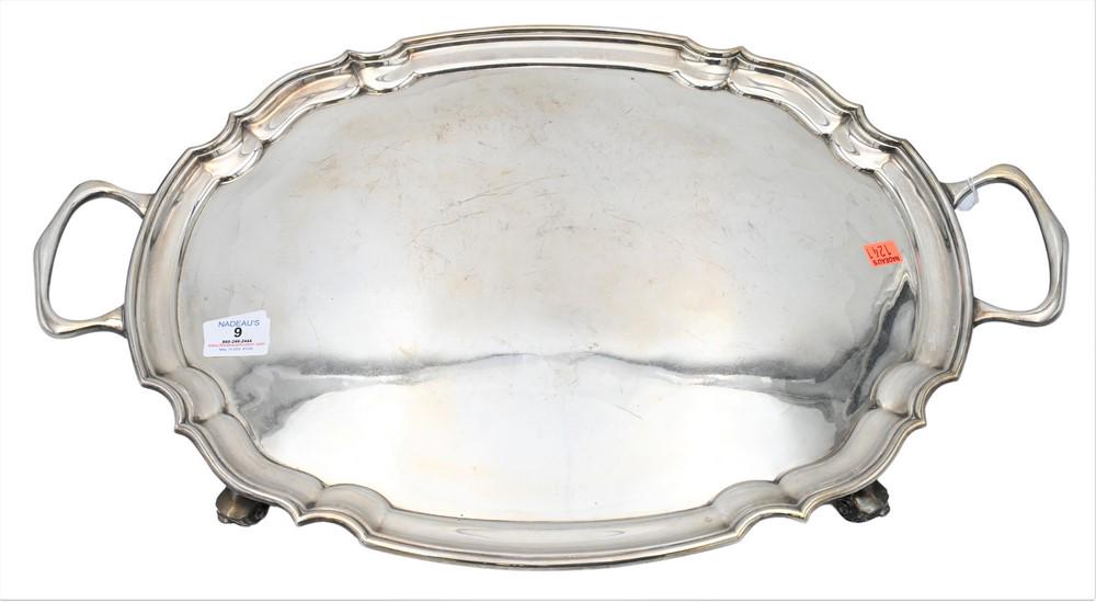 Silver Two Handle Tray, on scrolled feet, total length 24 1/2 inches, 81.4 t.oz. Provenance: (1 of 5)