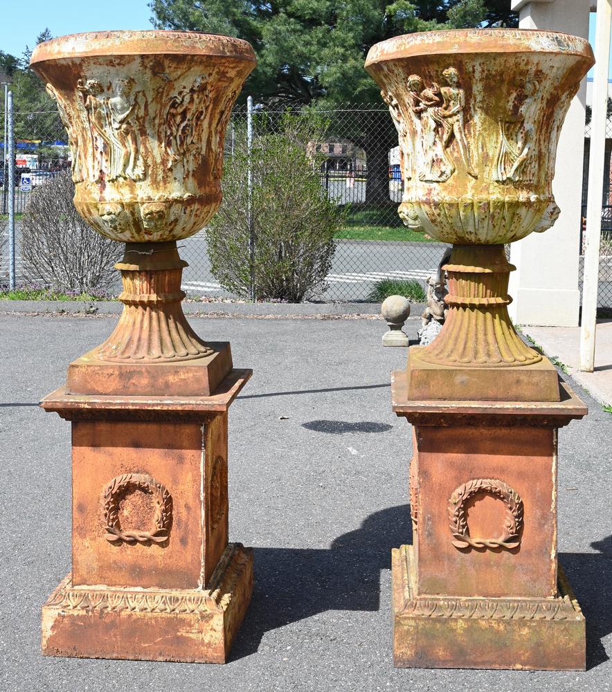 Pair of Large Iron Urns on Pedestals, having classical figures, all set on square pedestals with (1 of 6)