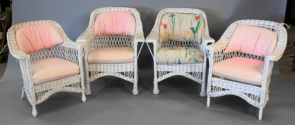 Group of Four Vintage Wicker Armchairs, to include cushions, (faded and soiled). Provenance: An (1 of 4)