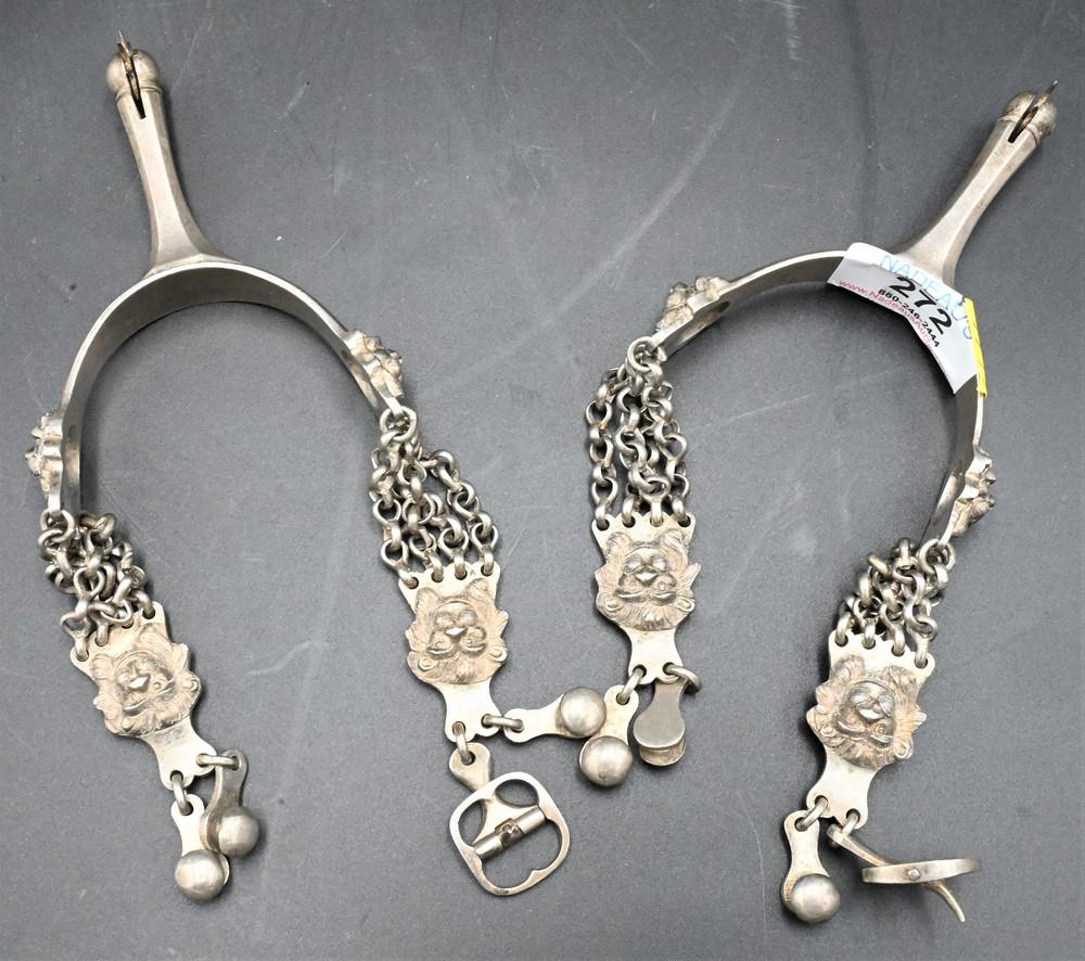 Pair of Spurs, having lion mask, (missing leather straps).: Pair of Spurs, having lion mask, (missing leather straps).