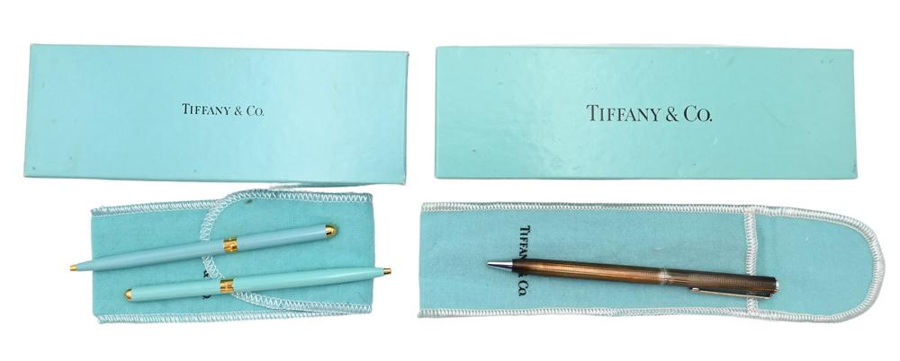 Three Tiffany & Company Pens, to include two Tiffany blue, along with one sterling silver, in boxes: Three Tiffany & Company Pens, to include two Tiffany blue, along with one sterling silver, in boxes and bags.