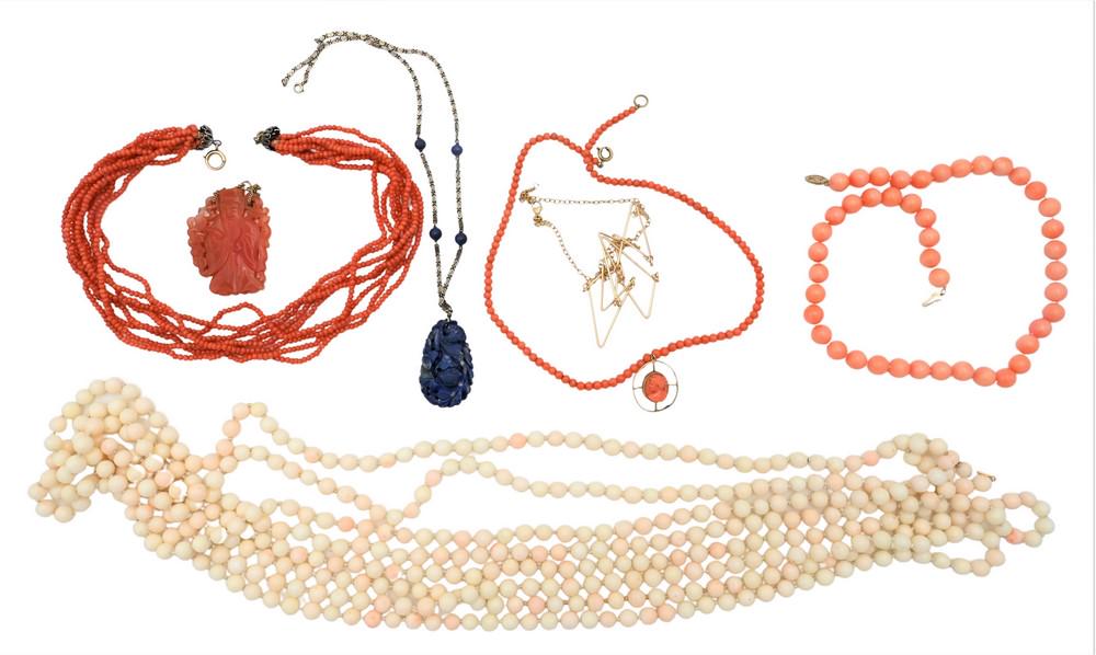 Group of Necklaces, to include a white stone beaded necklace having 14 karat gold clasp, length 12: Group of Necklaces, to include a white stone beaded necklace having 14 karat gold clasp, length 12 feet; two coral necklaces; a pink stone necklace; a carnelian pendant; along with a carved lapis pend