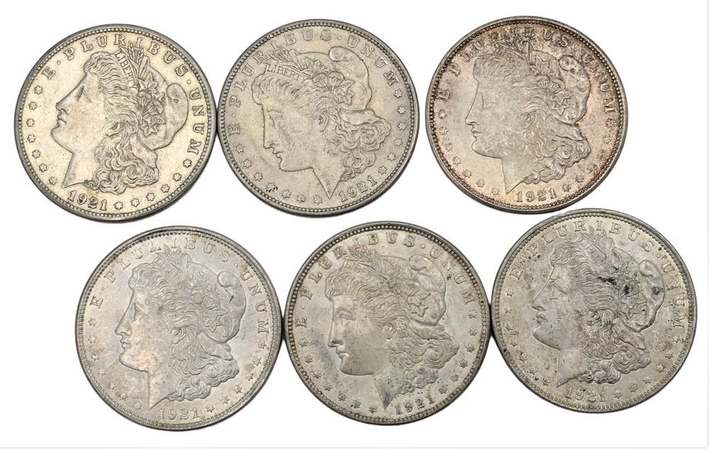 Six Morgan Silver Dollars, to include fine and AU. (1 of 2)