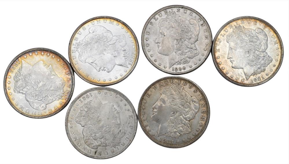 Six Morgan Silver Dollars, to include two 1882 uncirculated Morgan silver dollars. (1 of 2)