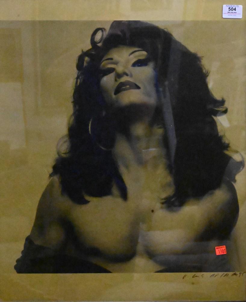 Michel Comte (Swiss, born 1954), gold selenium toned gelatin print of man in drag, signed lower (1 of 4)