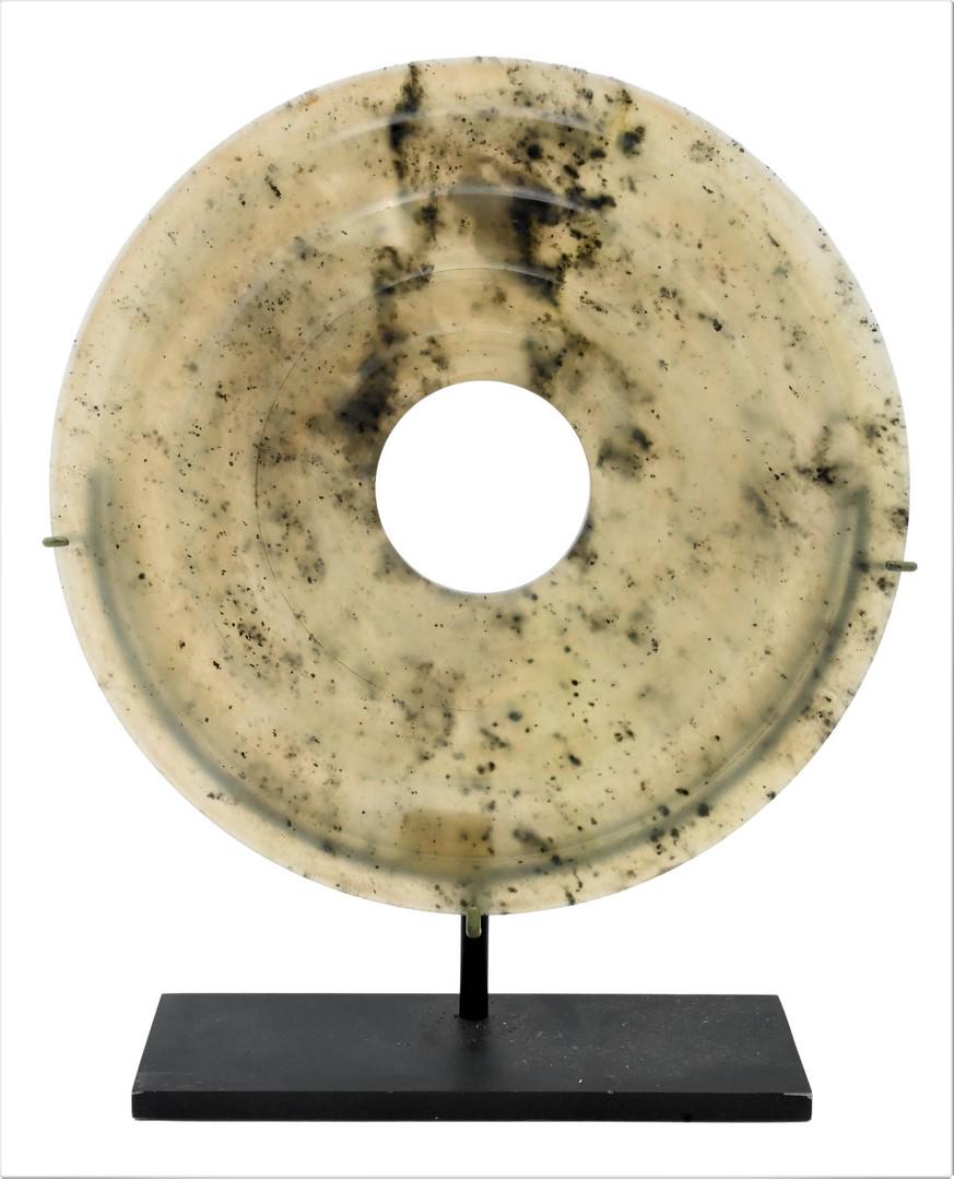 Celadon Jadeite Disc: Celadon Jadeite Disc, spinach green, diameter 7 1/4 inches. Provenance: Estate of Peter Tillou, Litchfield, Connecticut.