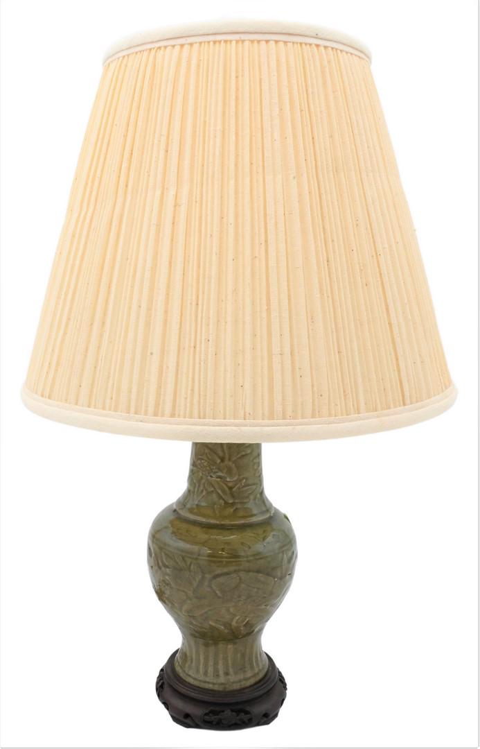 Chinese Celadon Green Glazed Ceramic Vase Turned Into Table Lamp: Chinese Celadon Green Glazed Ceramic Vase Turned Into Table Lamp, having incised flowers and leaves, vase height 10 1/2 inches, total height 21 1/2 inches. Provenance: Estate of Peter Tillou, Litchfie