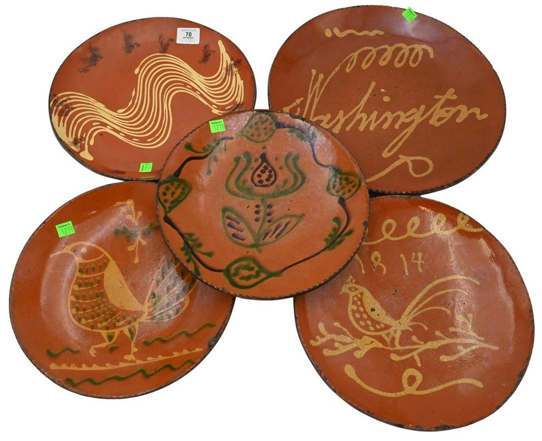 Five Greg Shooner Redware Slipware Chargers: Five Greg Shooner Redware Slipware Chargers, having all different painted designs in Early American manner, all signed on bottom, largest diameter 14 inches. Provenance: Estate of Peter Tillou, Litchf