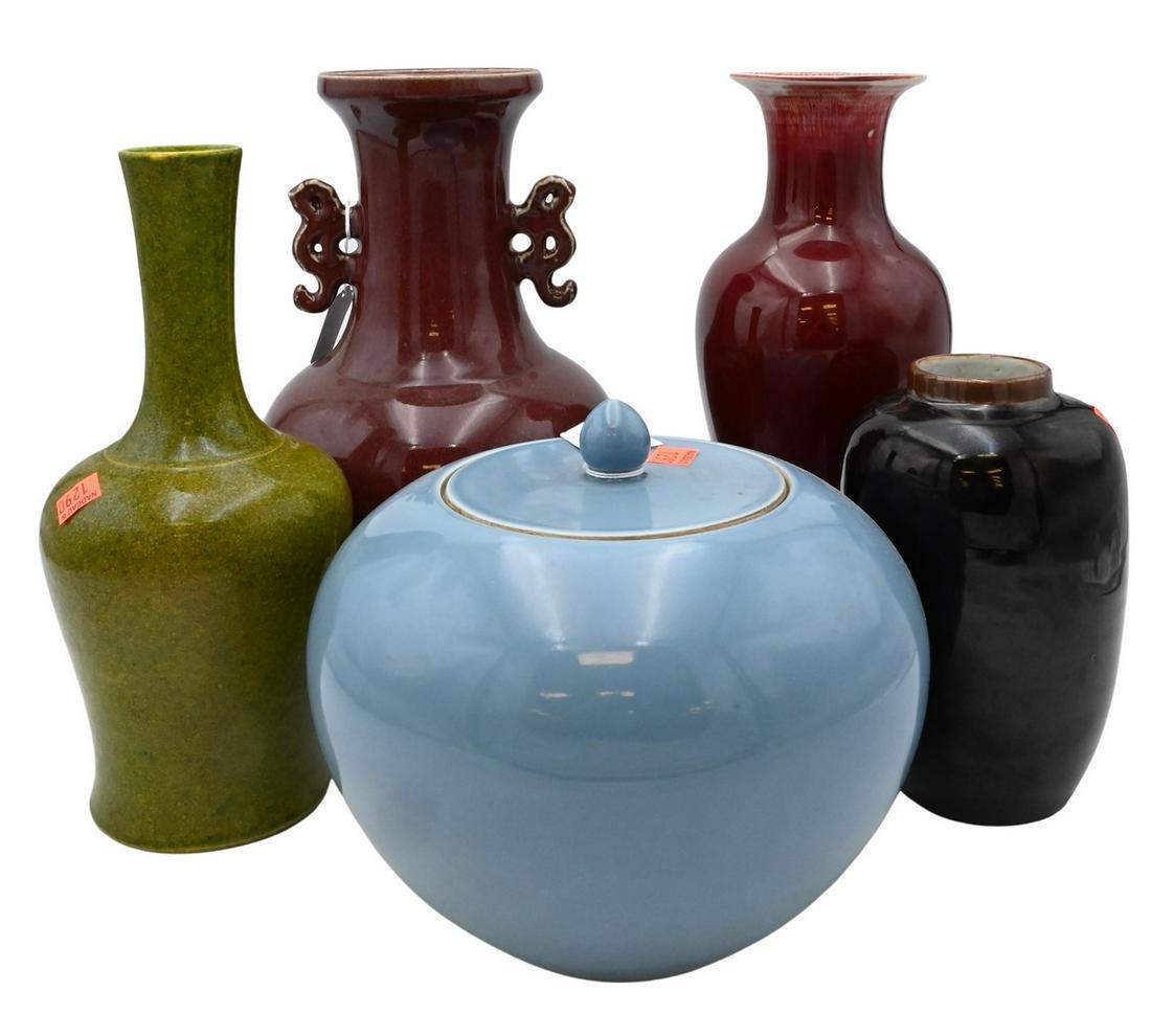 Five Chinese Glazed Porcelain Pieces: Five Chinese Glazed Porcelain Pieces, to include a mirror black glaze vase, two sang de boeuf glazed vases, a green and yellow vase, along with a light blue ginger jar with cover; tallest 12 inches.