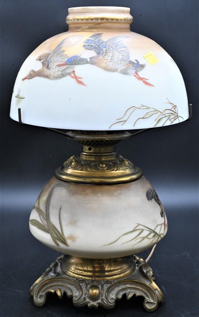 Mt. Washington Royal Flemish "Duck" Oil Lamp: Mt. Washington Royal Flemish "Duck" Oil Lamp, having painted flying ducks on the base with a duck in a pond on the shade, electrified, height 16 inches. Provenance: From the Estate of Elwyn W. Lemon, 