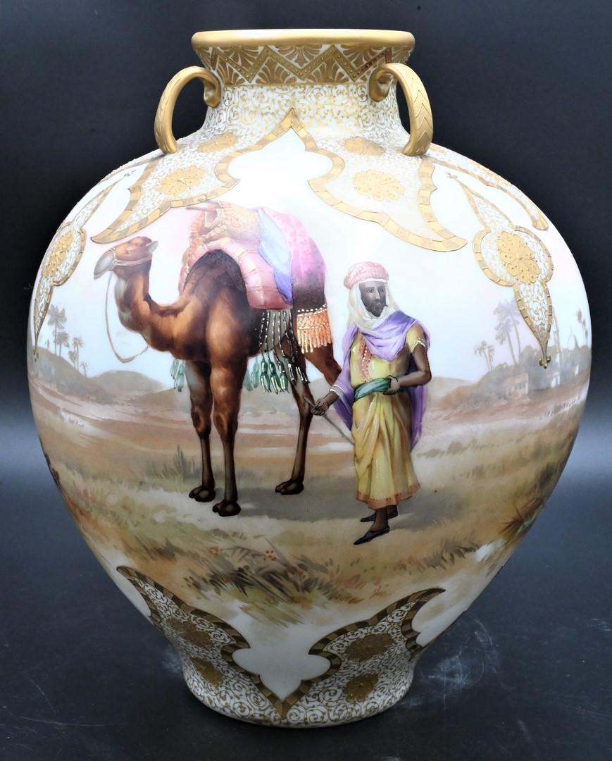 Mt. Washington Crown Milano Three Handled Vase: Mt. Washington Crown Milano Three Handled Vase, depicting Middle Eastern scenes with camels and pyramids, marked with crown on bottom, height 14 inches. Provenance: From the Estate of Elwyn W. Lemon, 