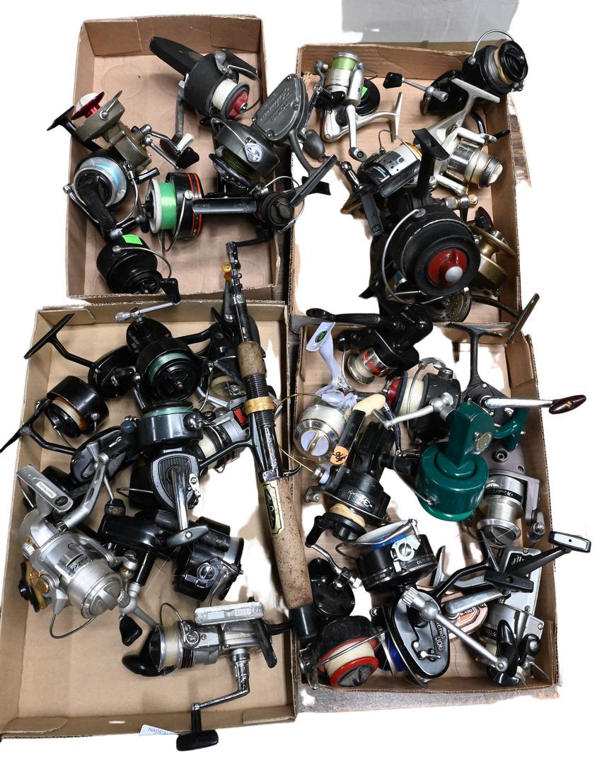 Approximately 34 Spincast Fishing Reels: Approximately 34 Spincast Fishing Reels, brands include Mitchell, Penn, L.L. Bean, Catera, along with others. Provenance: Estate of Peter Tillou, Litchfield, Connecticut.