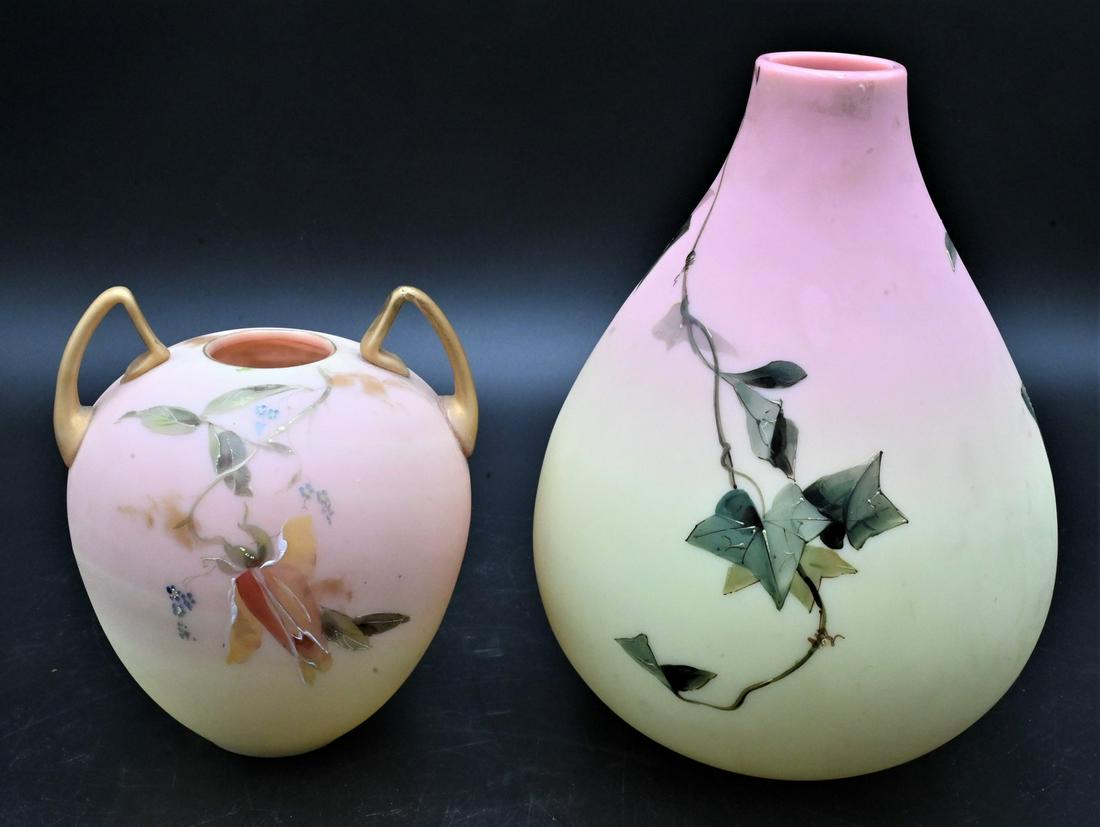 Two Mt. Washington Burmese Poem Vases: Two Mt. Washington Burmese Poem Vases Charles Dickens and Thomas Hood, painted flowers and leaves, repaired handle, height of repaired handle vase 6 inches, cracked, height of the other vase 8 inches.