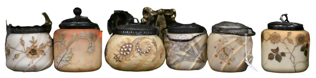 Six Mt. Washington Glass Jars: Six Mt. Washington Glass Jars, having raised gold and flowers, biscuit and sweet meat, tallest height 5 inches. Provenance: From the Estate of Elwyn W. Lemon, Enfield, Connecticut.