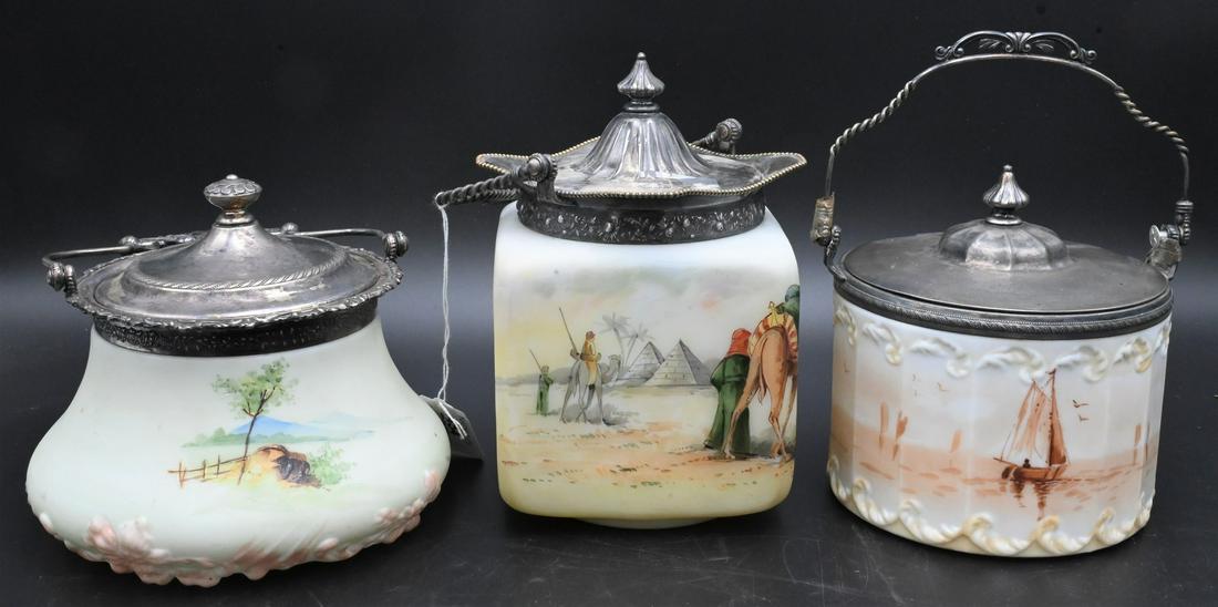 Three Mt. Washington Glass Scenic Biscuit Jars: Three Mt. Washington Glass Scenic Biscuit Jars, one Egyptian with painted camels and pyramids, tallest height 7 inches. Provenance: From the Estate of Elwyn W. Lemon, Enfield, Connecticut.