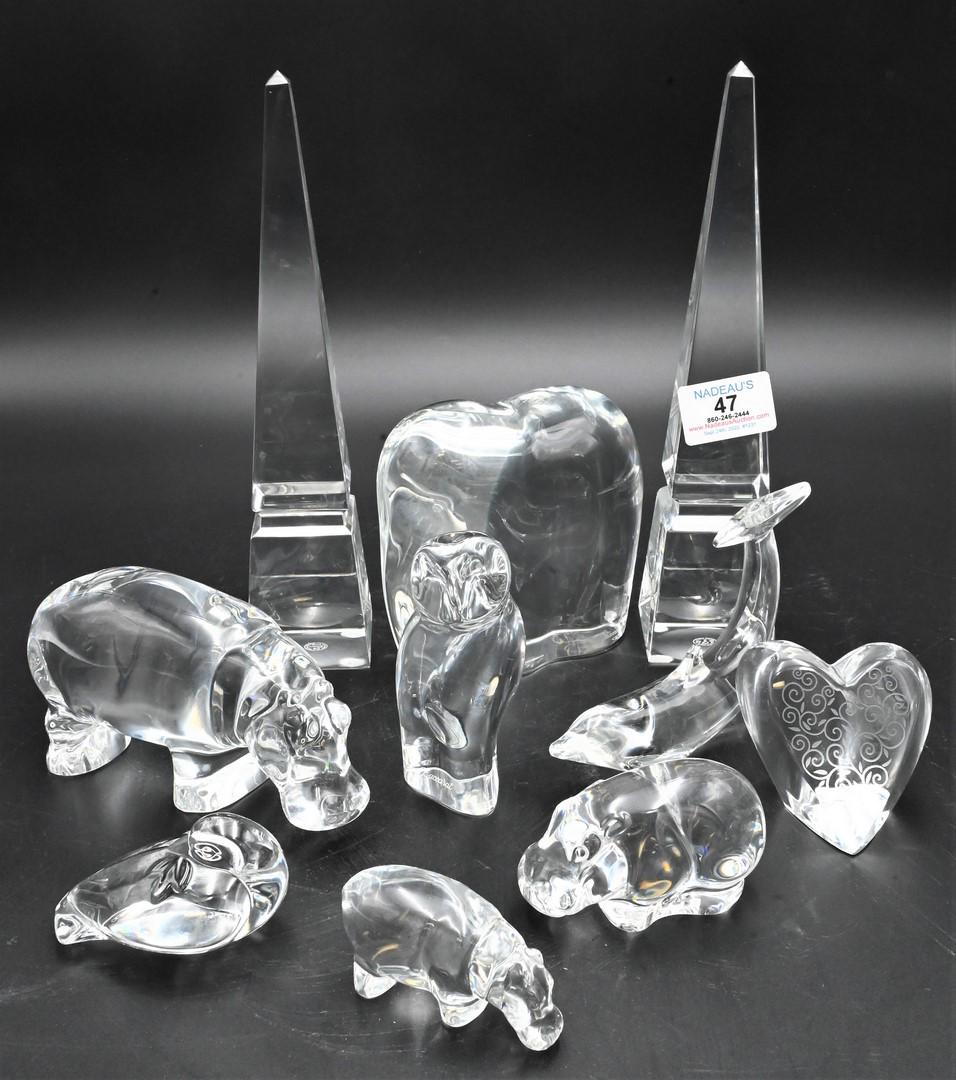 Ten Piece Baccarat Crystal Group: Ten Piece Baccarat Crystal Group, to include two hippo figures, dolphin, owl, elephant, heart, along with a pair of obelisks; tallest 10 inches.