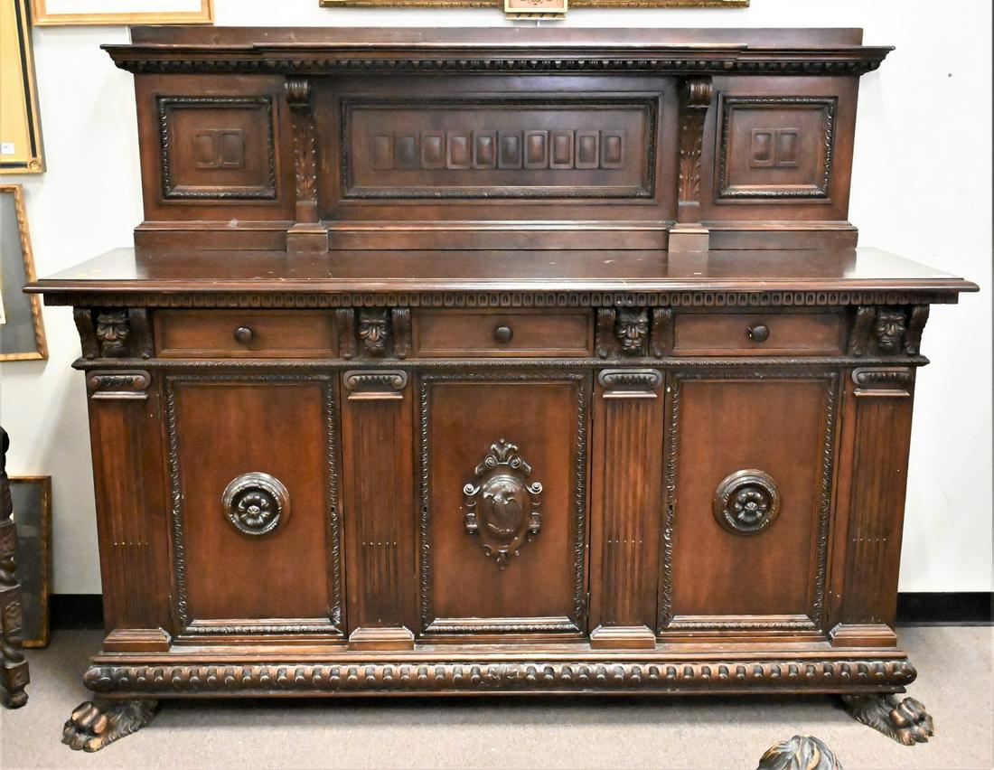 Walnut Sideboard: Walnut Sideboard, having large paw feet, height 64 inches, width 77 inches.