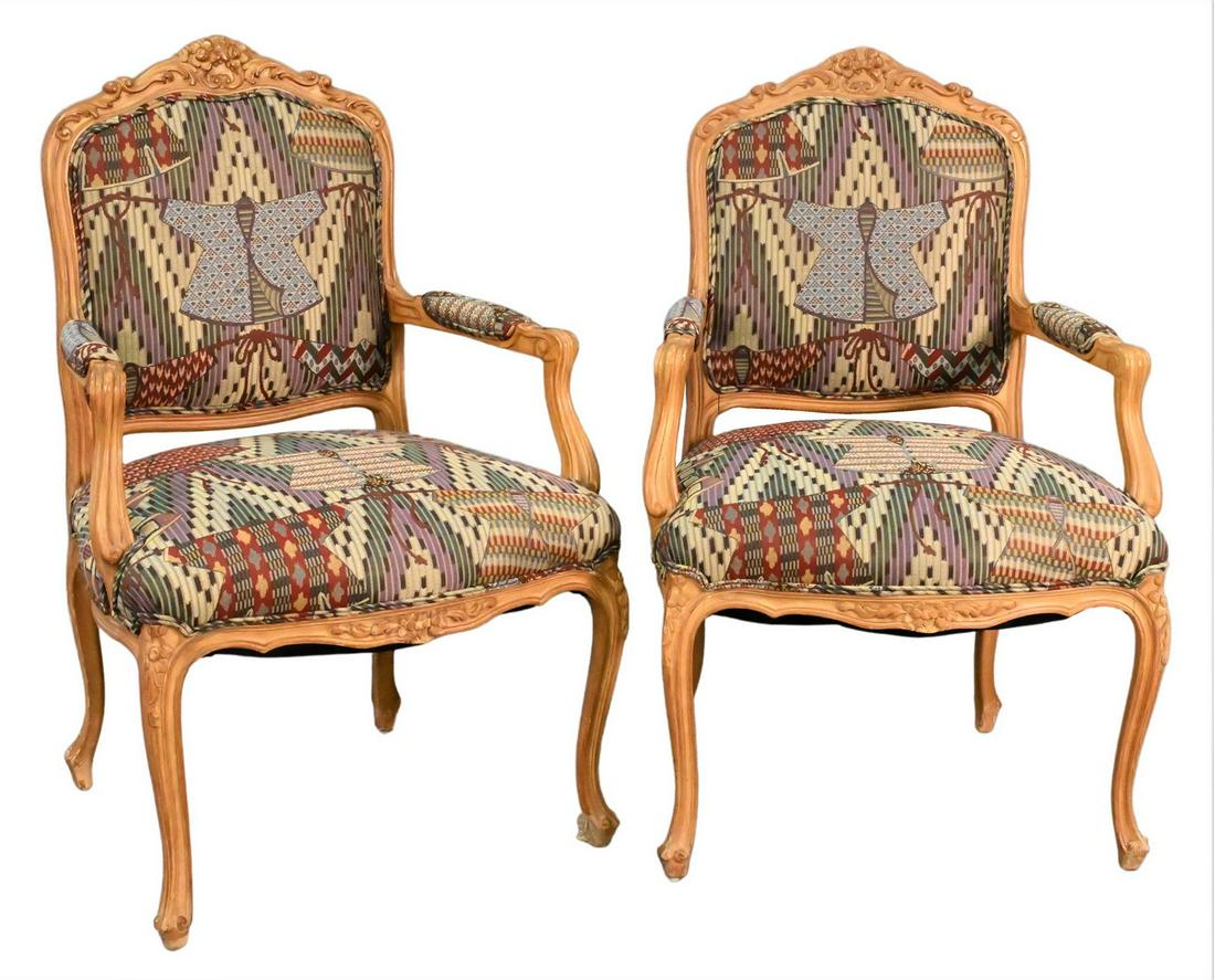 A Pair of Louis XV Fauteuils: A Pair of Louis XV Fauteuils, each having carved frames and custom upholstery (one arm repaired), height 40 inches, width 27 inches.