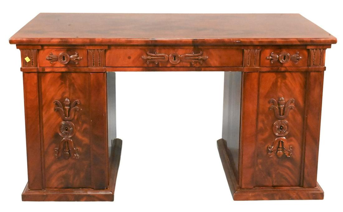 Rosewood Kneehole Desk: Rosewood Kneehole Desk, having one long drawer flanked by short drawers over doors, unfinished backside, height 30 1/2 inches, top 28" x 56".