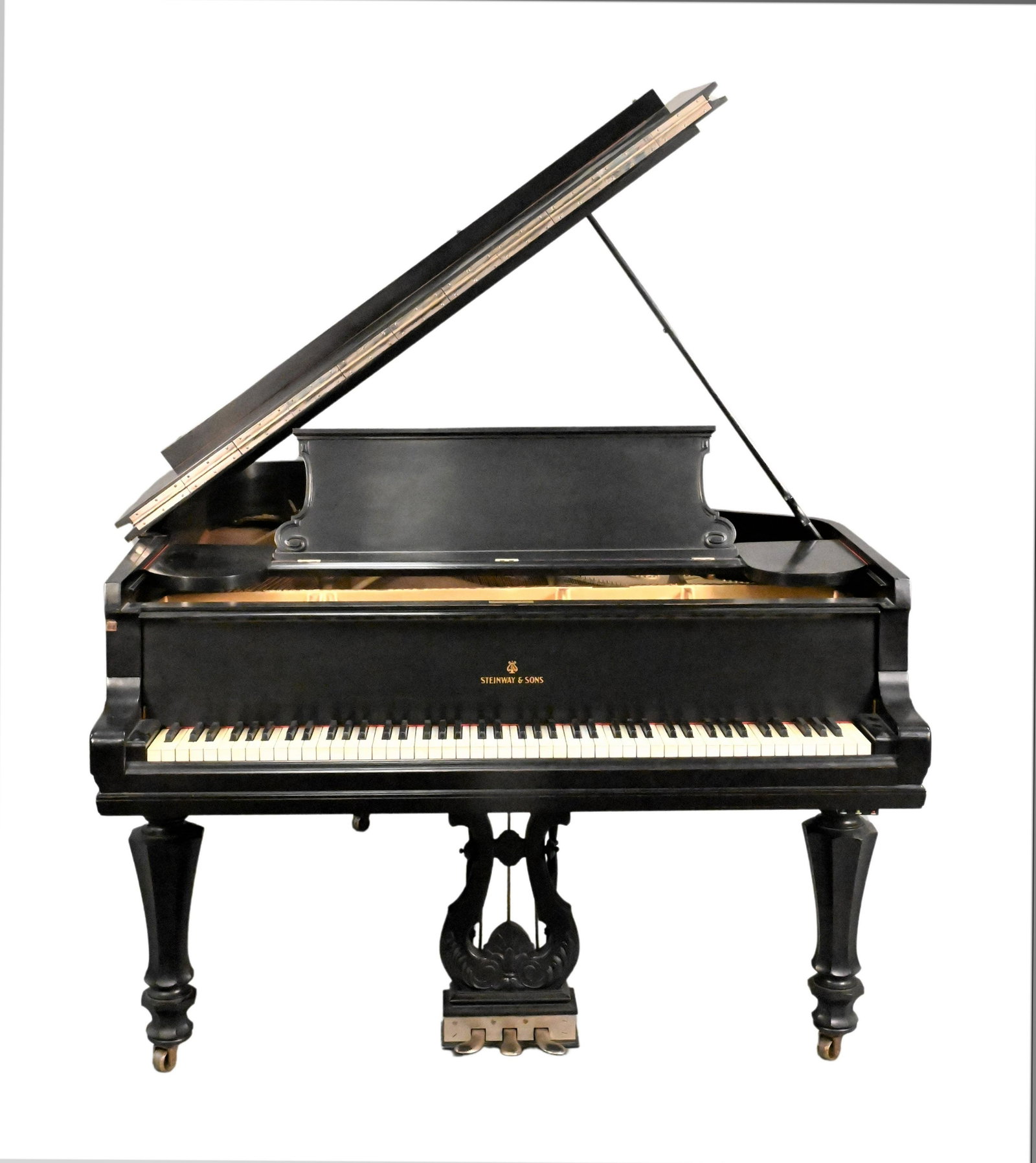 Steinway & Sons Grand Piano: Steinway & Sons Grand Piano duplex scale, in ebonized case serial #139402 length 73 inches Condition: cracks to soundboard, minor scuffs to body, yellowing of keys, one key with crack