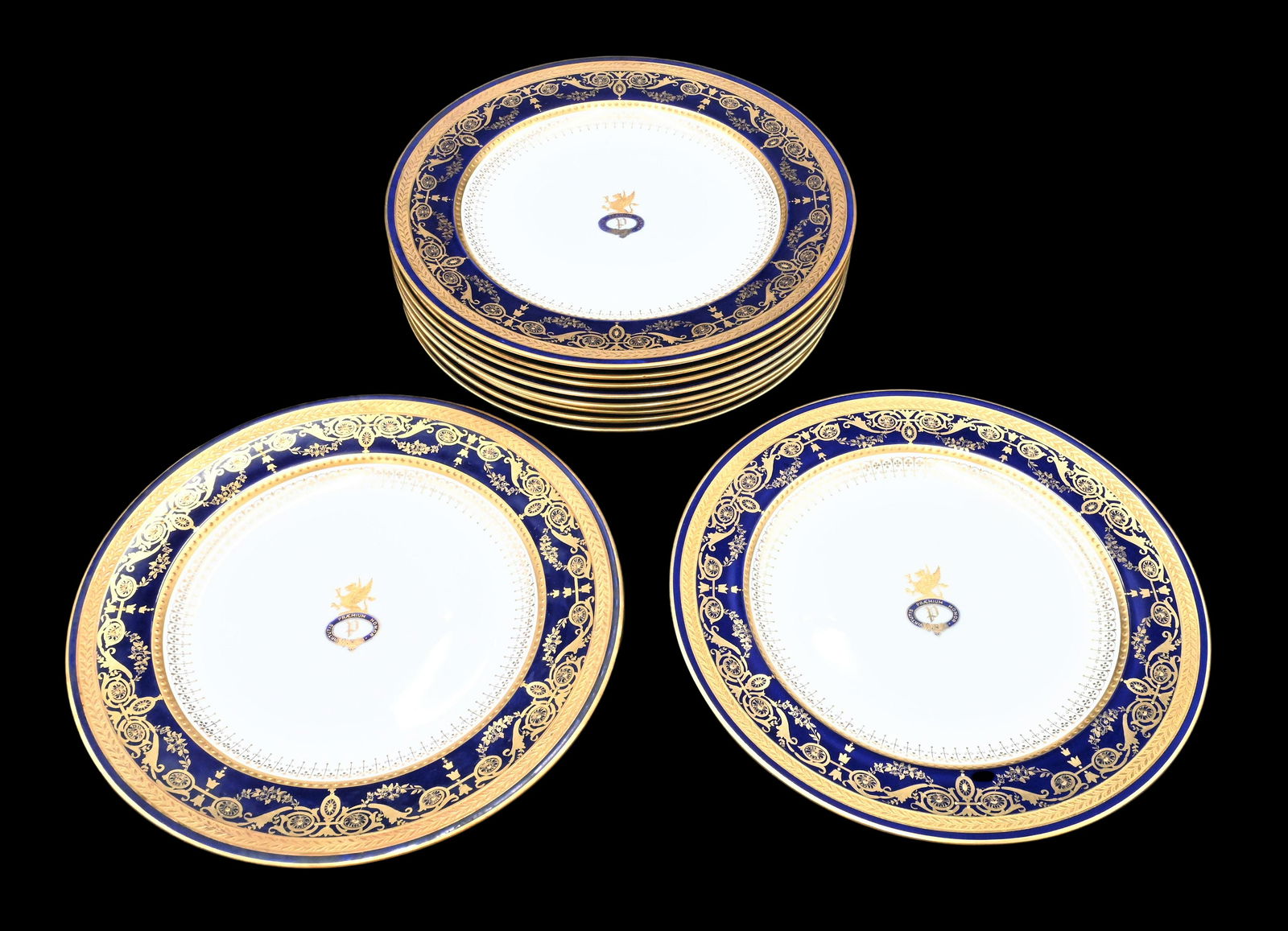 Set of 10 Wedgwood Porcelain Dinner Plates: Set of 10 Wedgwood Porcelain Dinner Plates having cobalt blue and heavy gilt gold phoenix bird decoration diameter 10 1/4 inches marked Virtutis Praemium Honor in center, bottom marked Wedgwood, Mortl