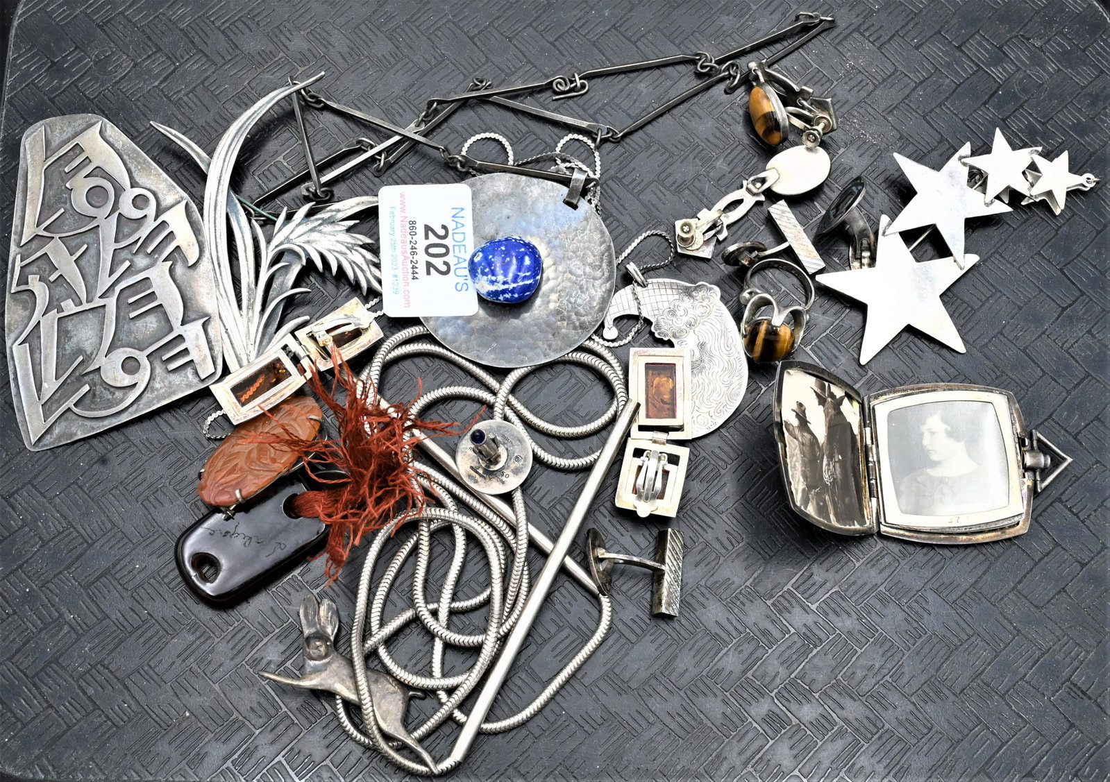 Lot of Silver Jewelry: Lot of Silver Jewelry, to include a silver and 14 karat locket with photos, handmade jewelry, earrings, cufflinks, brooches, etc.