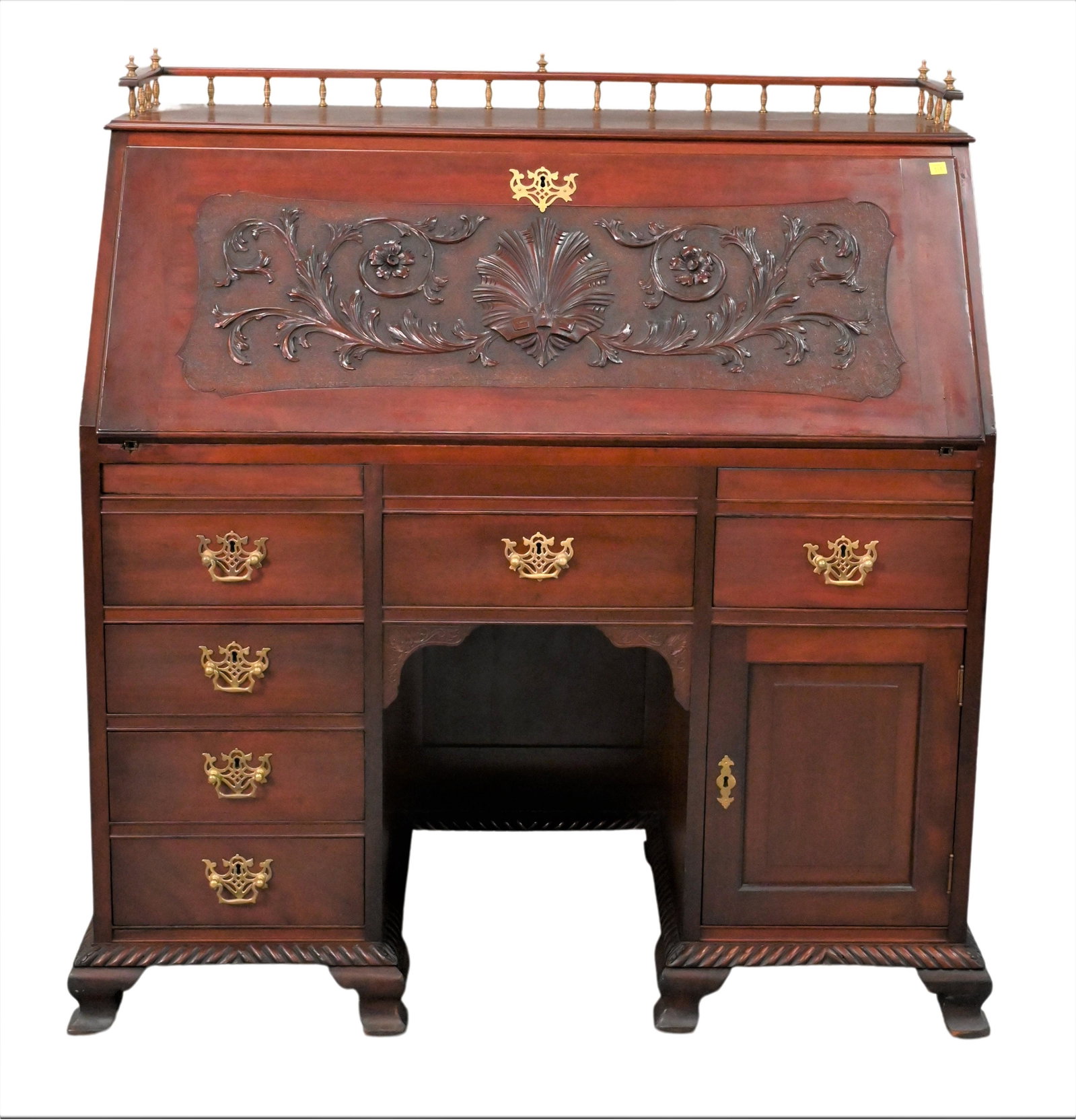 Victorian Mahogany Drop Front Knee Hole Desk: Victorian Mahogany Drop Front Knee Hole Desk, having brass and wood gallery, height 46 inches, width 42 1/2 inches.