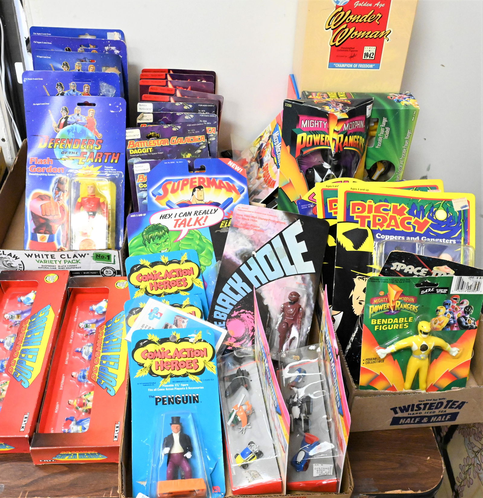 Large lot of Superhero Memorabilia: Large lot of Superhero Memorabilia, to include Defenders of the Earth 1985 action figures, 1978 Battlestar Galactica action figures, 1980 Clash of the Titans action figures, Wonder Woman 1996, along w