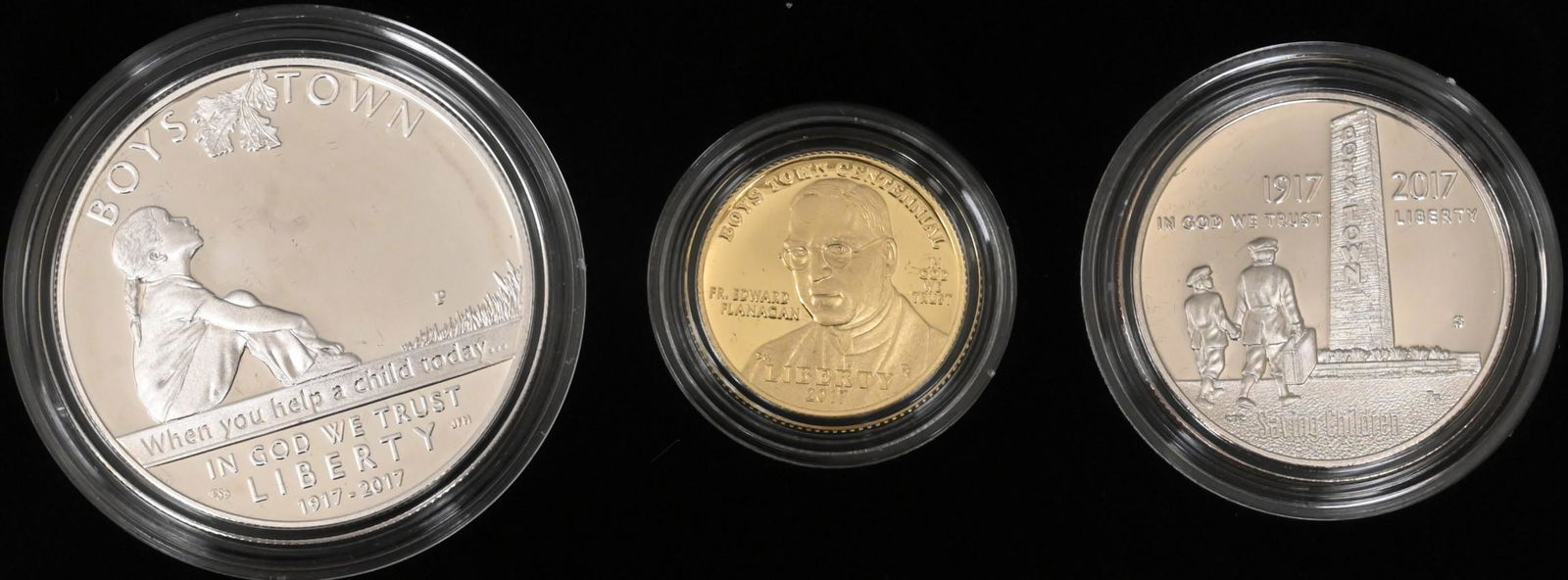A Pair of Solomonic Floor Lamps: Three Coin Commemorative Boys Town Set, to include one $5 dollar gold coin, one silver dollar, and one half dollar 8.35 grams .900 fine gold.